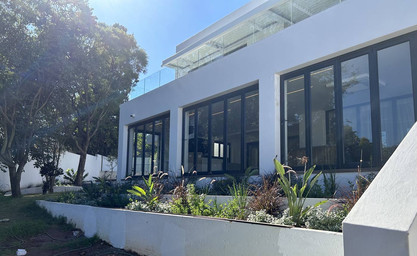 Charcoal aluminium folding doors on a modern home