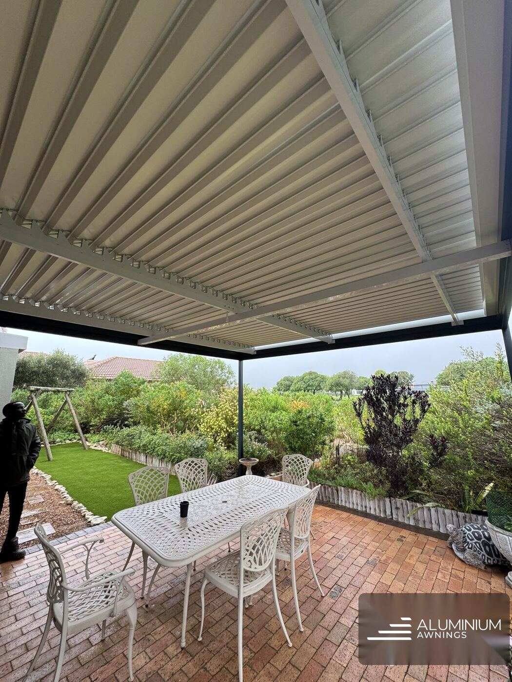 Charcoal white louvre roof west coast