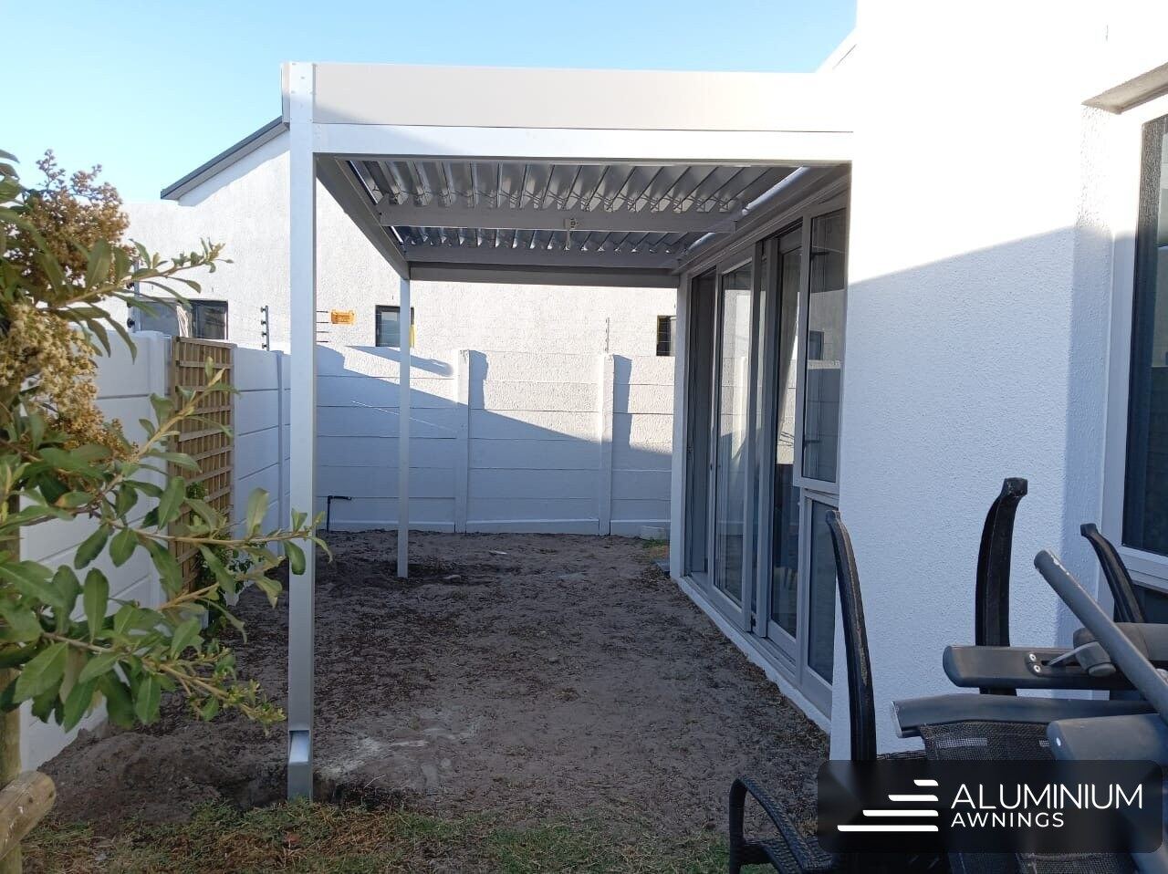 Dove-grey louvre awning with white blades in Sandown.