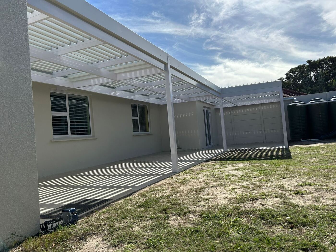 Side view of the white louvre awning frame and posts in Bellville.