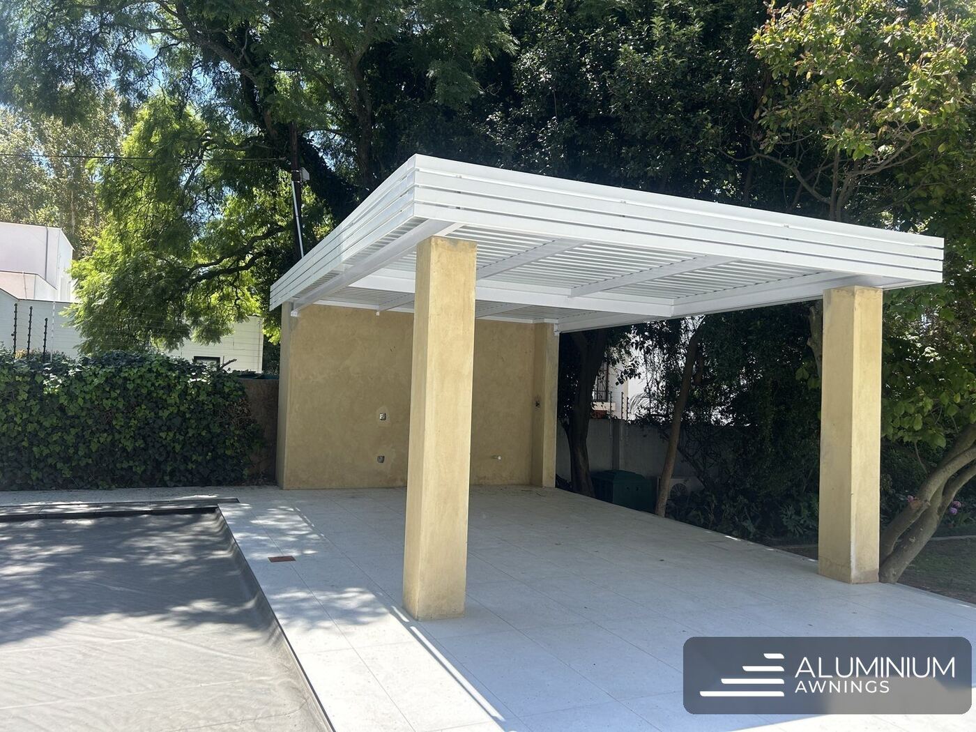 Aluminium fixed IBR awning over a patio