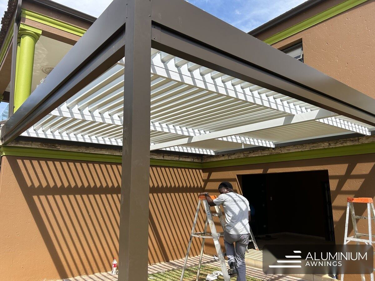 Bronze aluminium louvre roof on a coastal home — Hermanus, Western Cape