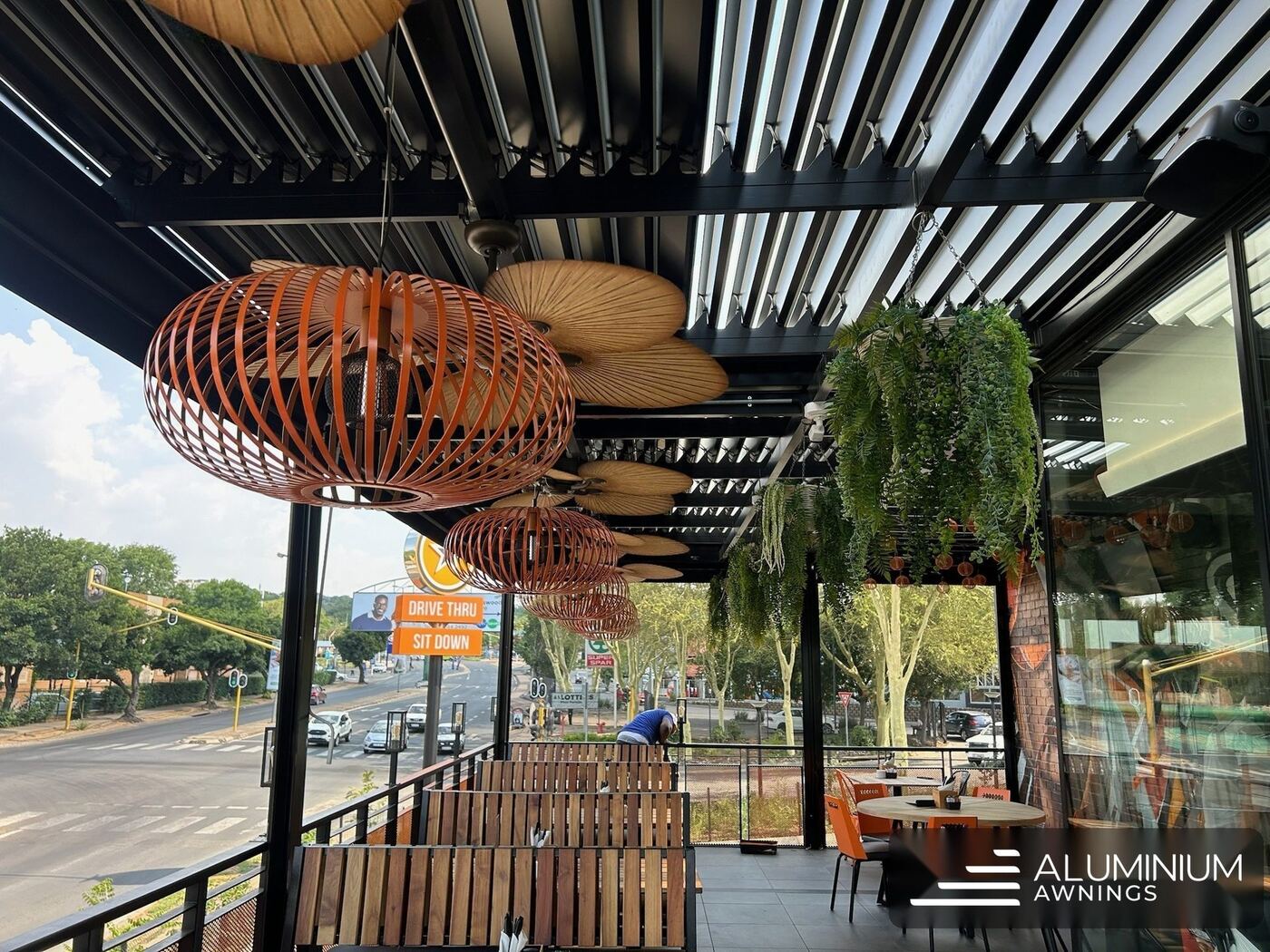Restaurant patio cover with pendant lighting