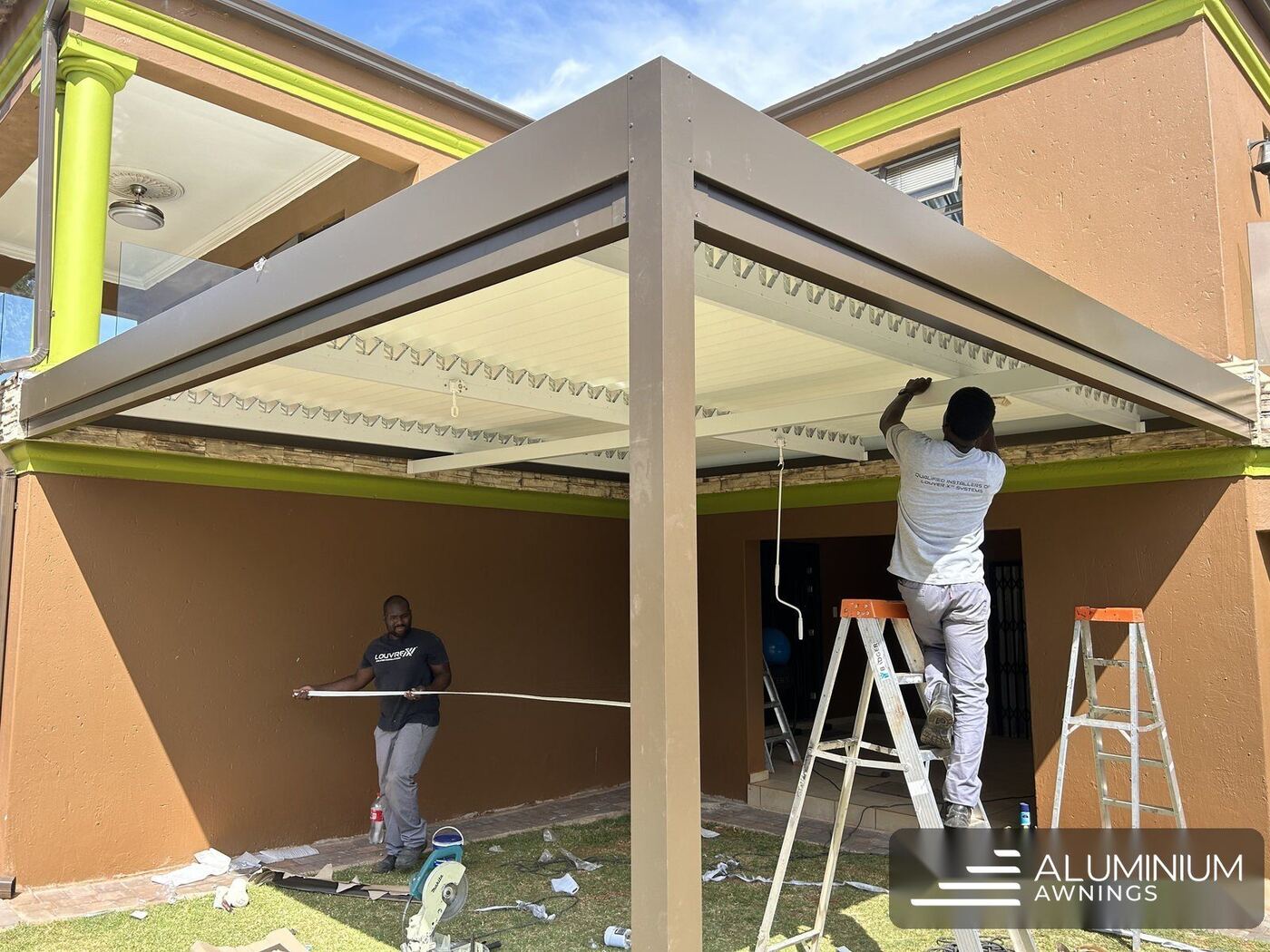 Bronze aluminium louvre roof over a coastal patio — Hermanus, Western Cape