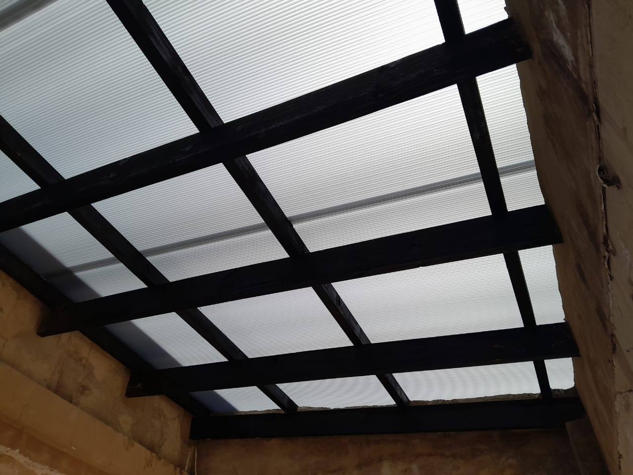 Opal multiwall polycarbonate panels on black rafters